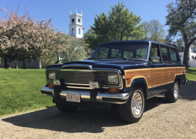 Classic Jeep Grand Wagoneer in a park