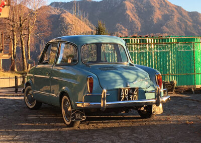 Full rear view of a baby blue NSU Prinz in sunshine