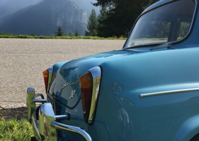 Rear bumper view of a baby blue classic NSU Prinz car