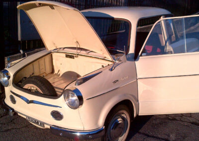 Open bonnet view of a beige classic NSU Prinz car which does not store the engine